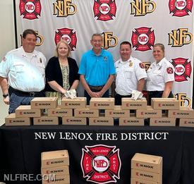 Pictured from left to right: James Brown, NLFD Fire Marshal, Margaret Batkiewicz, Family Services Foundation of New Lenox Township Board Member, Jim Pitcairn, New Lenox Township Facilities and Program Director, Adam Riegel, NLFD Chief, and Marisa Tomich, NLFD Fire and Life Safety Educator.